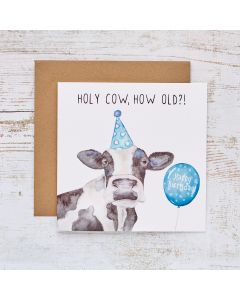 HOLY COW BIRTHDAY CARD WHITE WITH BLUE PARTY HAT & BALLOON