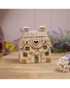 STONEWARE LARGE THATCHED COTTAGE WITH EMBOSSED FLOWERS AND GREEN DOOR TEA LIGHT HOLDER