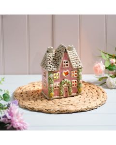 COTTAGE GARDEN STONEWARE HOUSE PINK WITH ROSE GARLAND AND CUT OUT HEART ALL EMBOSSED DETAILS CANDLE HOLDER