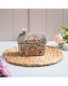 COTTAGE GARDEN STONEWARE LIGHT BLUE HOUSE WITH MUSHROOMS AND DAISY DOOR GARLAND ALL EMBOSSED DETAILS CANDLE HOLDER