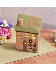 FLORAL SERENADE STONEWARE SAGE GREEN ROOF WITH EMBOSSED FLOWER DETAILS CANDLE HOLDER