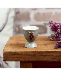 HIGHLAND COW EGG CUP PALE GREEN EMBOSSED STONEWARE