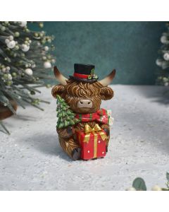 HIGHLAND COW WITH TOP HAT, PRESENT AND CHRISTMAS TREE SITTING RESIN ORNAMENT
