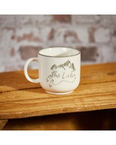 LAKES MUG CREAM STONEWARE WITH GREY MOUNTAINS & FOOTPRINTS