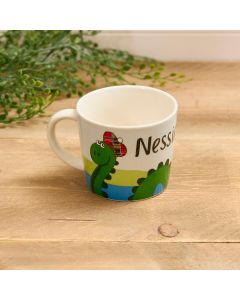 NESSIE MUG WHITE STONEWARE WITH LOCH & TARTAN HAT
