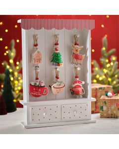 JINGLE AND JOY WOODEN 6 ASSTD HANGERS ON WOOD DRESSER 36